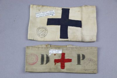 two old cloth bags with red cross and blue cross on them