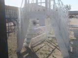 a white staircase going up to the top of a building