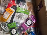 a cardboard box filled with various electronic items