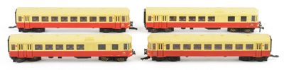 four yellow and red train cars sitting next to each other on a white surface