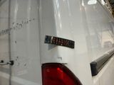 a white van with a sticker on the back of it