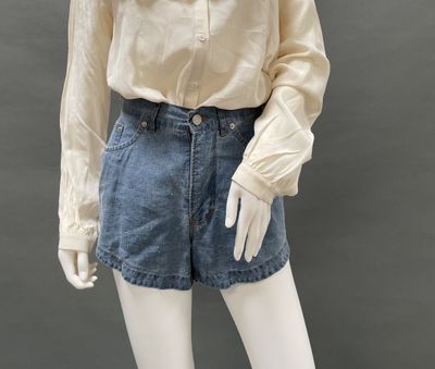 an image of a mannequin mannequin wearing a shirt and denim shorts