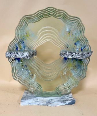 a glass plate with a blue and white design on it