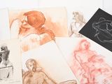 many different colored drawings of people on a table