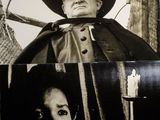 une photo en noir et blanc représentant un homme vêtu d'une cape et une femme portant un chapeau