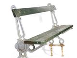 a metal bench that is sitting on a white surface
