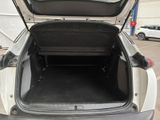 a trunk of a car that is open in a parking lot