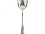 a silver spoon with a spoon handle on a white surface