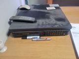 an image of a remote control and a dvd player on a desk