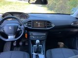the interior of a small car with a steering wheel and dashboard