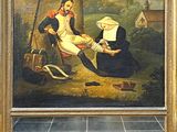 un vieux tableau représentant un homme et une femme assis devant un bâtiment