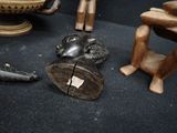 many wooden sculptures that are sitting on the floor