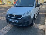 a small white van parked on the side of the street
