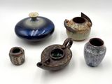 many different types of vases on a white surface