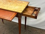 a small table with a drawer on top of it
