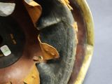 a close up of a vase with a sunflower design on it
