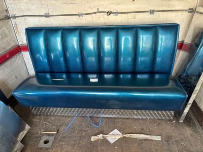 an image of a blue bench in a garage