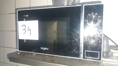 a microwave sitting on top of a counter in a kitchen