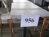 a table with a price sign on it in a restaurant