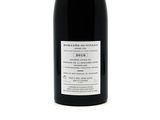 a bottle of wine that is sitting on a table