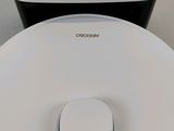 a white and black air purifier and a black and white air purifier next to each other