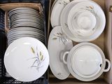 many plates and bowls in a box together