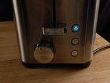 an image of a toaster on a wooden table