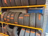 a lot of tires on the shelves in the store