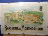 tableau représentant une vue d'une ville avec une rivière et des usines