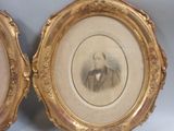 two framed pictures of a man and a woman in formal clothes