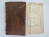 an old book with a brown cover and a drawing of a plane on it