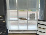 an image of a room with a window and a bookcase
