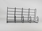 a black rack that has five pairs of shoes on it