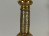 brass plated table lamp with a glass shade on top of it