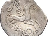 an image of a coin with a horse and a man on it