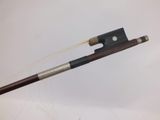 an image of a violin bow with a stick sticking out of it