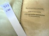 an old book with a sticker on top of it