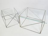these are two glass tables that are sitting on a white surface