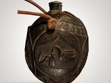 an image of a black vase with a wooden handle