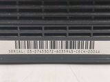the back of a laptop computer with a bar code on it
