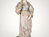 an image of a statue of a woman in a dress