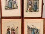 four framed pictures of people in medieval clothing standing in front of a wall