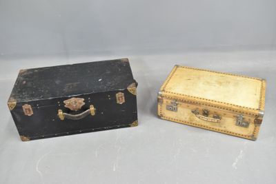two suitcases sitting next to each other on a table
