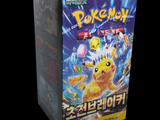 a box of pokemon trading cards on a black background