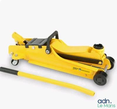 a close up of a yellow hydraulic jack on a white background