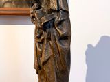 a statue of a woman holding a baby on a table