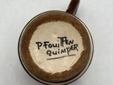 a cup of coffee with writing on it on a table