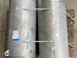 two metal cylinders sitting on top of a wooden pallet