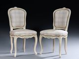 pair of chairs with upholstered back and upholstered seat