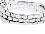 a close up of a silver bracelet on a white background